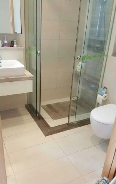 Clean glass shower and bathroom floor