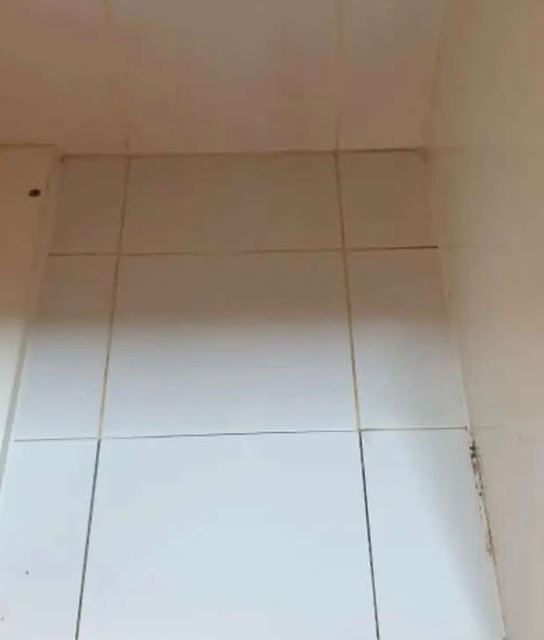 White tiles under the sink after cleaning